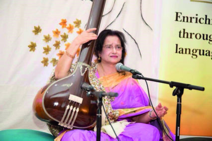 Banani playing tanpura at a Poetry and Esraj event in Birmingham, 2017